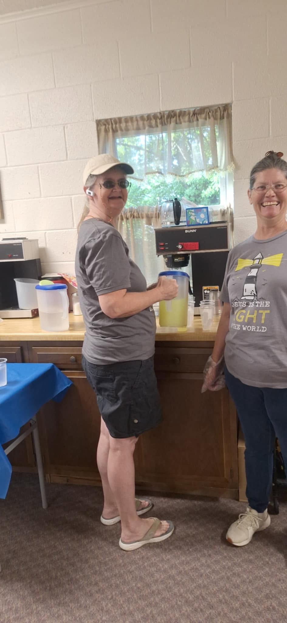 Two women preparing refreshments in the church kitchen